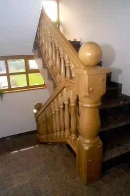 a wooden staircase in a house with a stair case at Rooms and Apartments Panker in Moravske Toplice