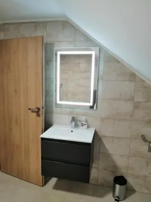 a bathroom with a sink and a window at BLATNIKOV HRAM in Dvor