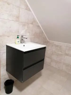 a bathroom with a sink in a room at BLATNIKOV HRAM in Dvor