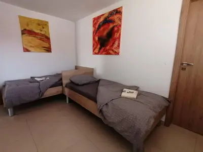 a room with two beds in a room at BLATNIKOV HRAM in Dvor