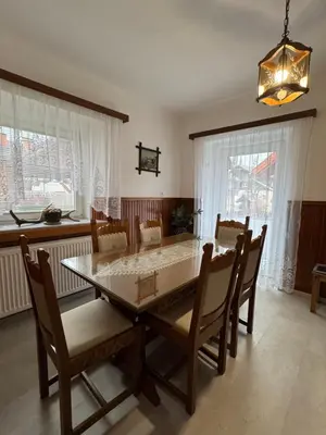 a dining room with a table and chairs at Apartmaji pr' Matičo in Kranjska Gora