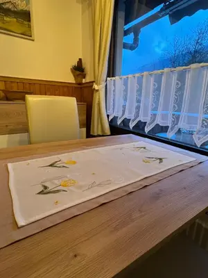 a table with a napkin on top of it at Apartmaji pr' Matičo in Kranjska Gora