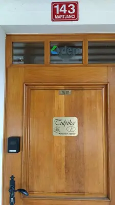 a wooden door with a sign on it at Tulpika1 in Moravske Toplice