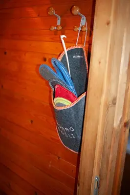 a pair of shoes hanging on a wall at Hišica 70 in Čatež ob Savi