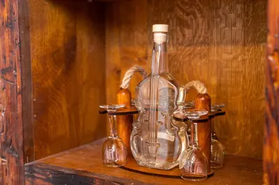a glass bottle sitting on top of a shelf at Guesthouse Močivnik in Okroglice