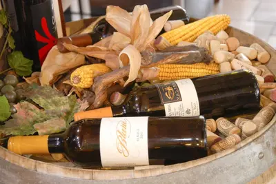 a bucket filled with bottles of wine and corn at Guest House Arvaj in Kranj