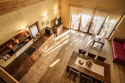 an overhead view of a living room with a table at Panonska Vas Villas in Moravske Toplice