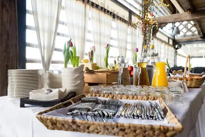 a table with a tray of utensils on a table at Panonska Vas Villas in Moravske Toplice