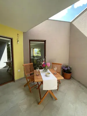 a dining room with a table and two chairs at Apartma 7 - In the heart of Soča Valley in Tolmin