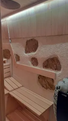 a small room with rocks on the wall of a boat at Gozdna koča Studeno in Kočevje