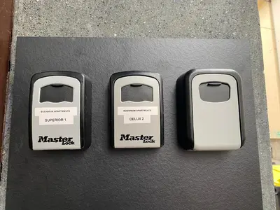 three usb controllers sitting on top of a table at Boennium Apartments in Ljubljana