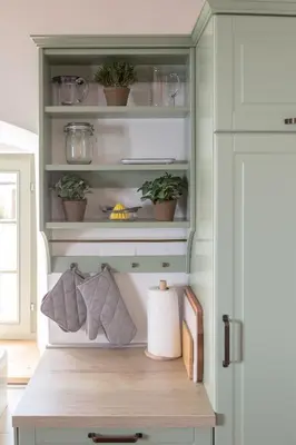 a hutch with potted plants on it in a kitchen at House Bella in Bohinjska Bela