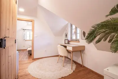 a room with a desk and a mirror at House Bella in Bohinjska Bela