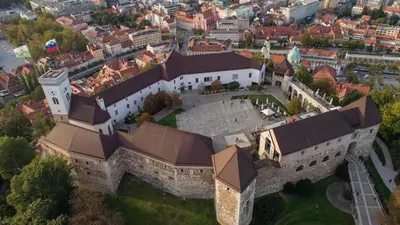 an aerial view of a large building with a tower at Twix apartment in Ljubljana