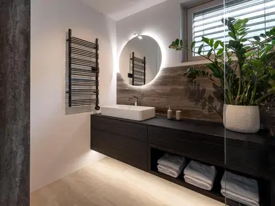a bathroom with a sink and a mirror at Maison du Soleil in Kranjska Gora