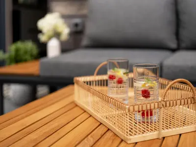 a wicker tray with two glasses on a table at Maison du Soleil in Kranjska Gora