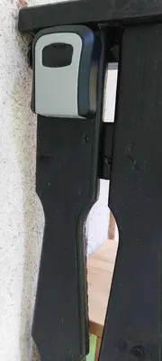 a black door with a toaster on top of it at Apartma Anja in Zgornje Gorje