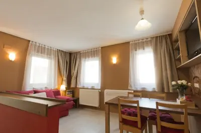 a living room with a couch and a table at City Centre Apartments in Ljubljana