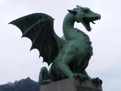 a statue of a dragon on top of a building at Hostel Tivoli in Ljubljana