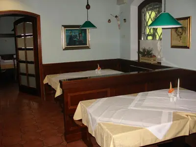a room with two tables with white sheets on them at B&B Janežič in Ljubljana