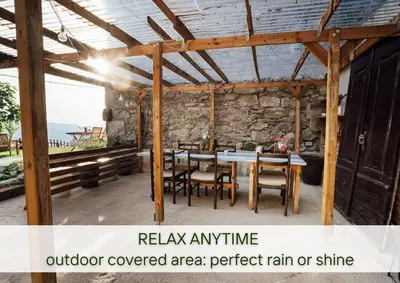 a wooden pavilion with a table and chairs at Villa Lapis in Črni Kal