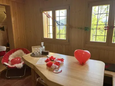 a room with a table with a heart on it at Chalet Orlica Velika Planina in Stahovica