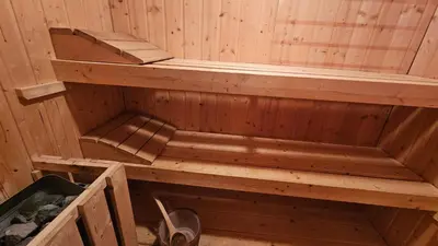 an inside of a sauna with wooden walls at Apartma AJJA in Šenčur
