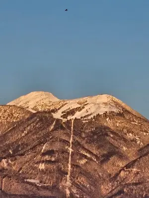 a brown mountain with the sky in the background at Apartma AJJA in Šenčur