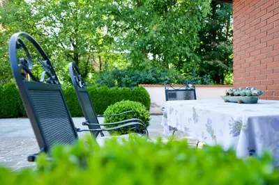 a table and two chairs and a table and a table and chairs sidx sidx sidx at Guest House Bakhus in Žerjavka