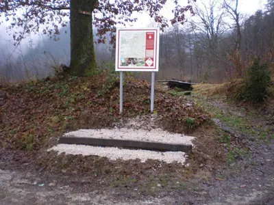 a sign sitting on the side of a road at Pri Lazarju Farm Stay in Podgrad