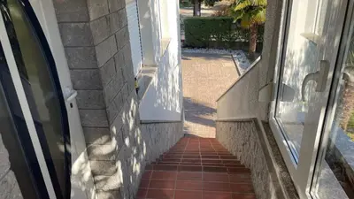 a stairway leading up to the door of a house at MADONCA ROOMS & RESTAURANT in Nova Gorica
