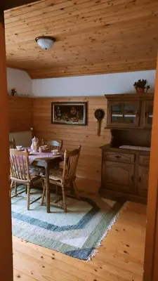 a dining room with a table and chairs at Alp House in Bohinjska Bela