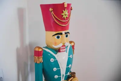 a toy nutcracker figurine with a crown on its head at Apartment VAZATAOR with sauna in Brežice