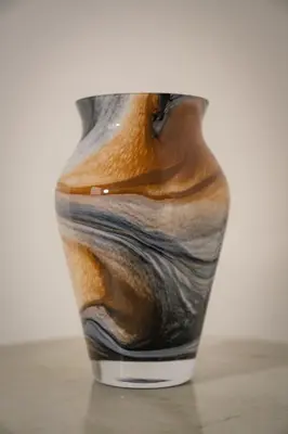 a vase sitting on top of a table at Apartment VAZATAOR with sauna in Brežice