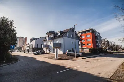 a building on the side of a street at Apartment VAZATAOR with sauna in Brežice