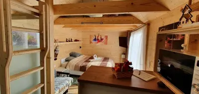 a bedroom with a bed in a small room at Apartma, glamping Na koncu vasi in Ljutomer
