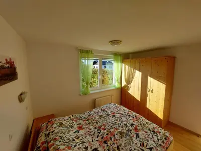 a bedroom with a bed and a window at Apartma TiJa in Moravske Toplice