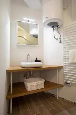 a bathroom with a sink and a mirror at APARTMENT SAPICA in Solkan