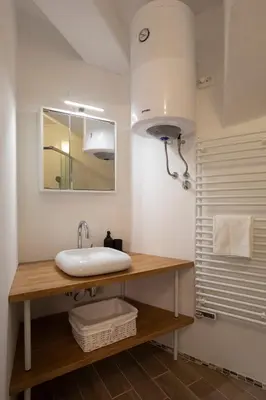 a bathroom with a sink and a mirror at APARTMENT SAPICA in Solkan