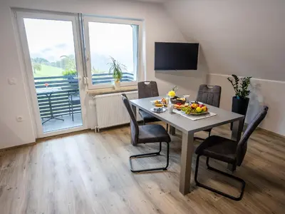 a dining room with a table with a bowl of fruit on it at Apartmaji Pr Smolet in Škofja Loka
