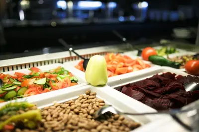 a buffet filled with different types of vegetables and nuts at Hotel Toplice - Terme Krka in Smarjeske Toplice