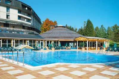 a large swimming pool in front of a building at Hotel Toplice - Terme Krka in Smarjeske Toplice
