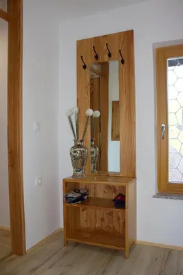 a dressing table with a mirror in a room at Malina in Vransko