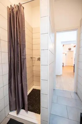 a shower with a glass door in a bathroom at BonAire apartment in Kranjska Gora