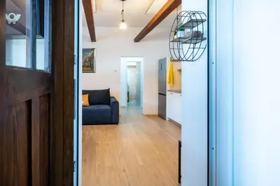 a living room with a blue couch in a room at BonAire apartment in Kranjska Gora