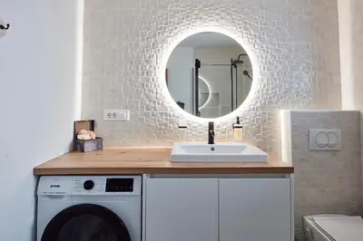 a bathroom with a sink and a mirror at AVA HOUSE in Kranjska Gora