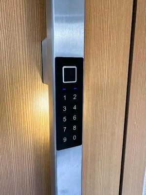 a close up of a remote control on a door at AVA HOUSE in Kranjska Gora