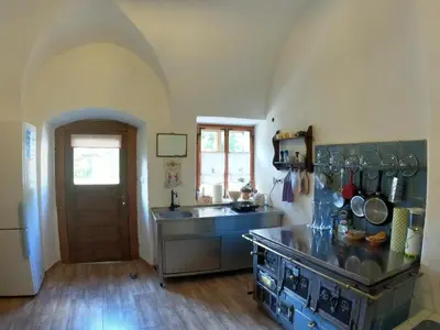 a kitchen with a sink and a counter top at Juvanova hiša (all house) in Luče