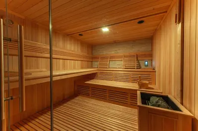 a sauna with wooden walls and wooden floors and a wooden at Villa DonLeone in Ponikva