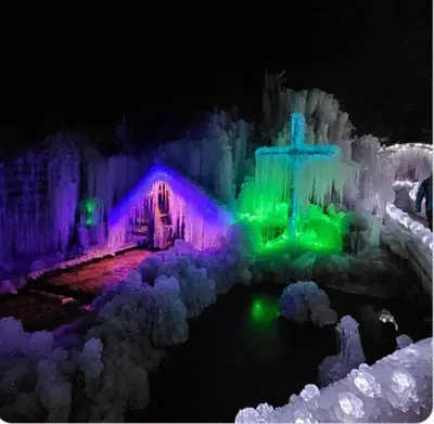 an ice house with a christmas light display at Apartma Lana in Mojstrana